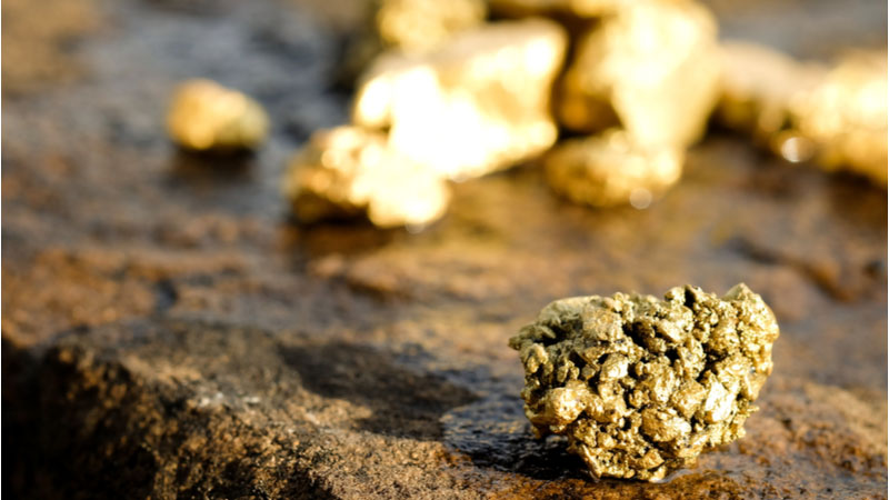 gold ore sitting on stone